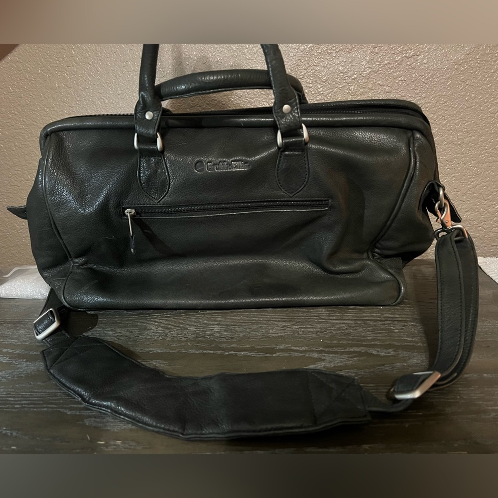 Leather bag. 12 inches tall X 17 inches long X 7 inches wide.